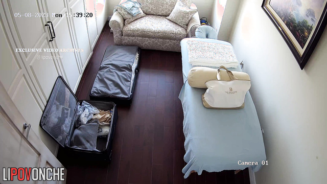 Blonde unpacking her clothes after an exotic trip