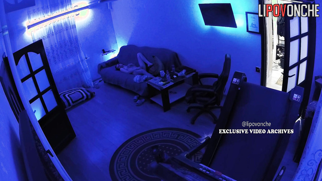 Naked couple enjoying each other in the living room