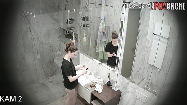 Lady cleaning herself up in the shower (bathroom video)