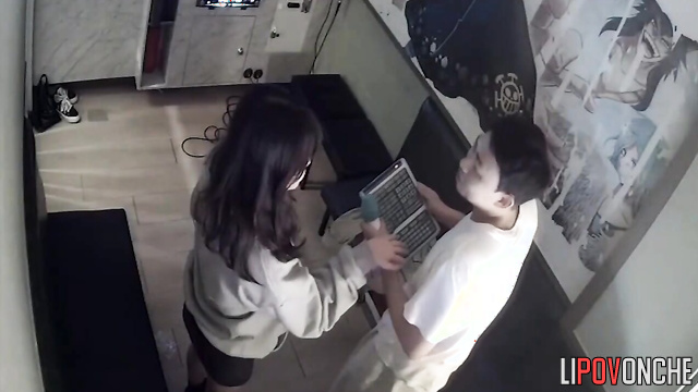 Young brunette sitting on his lap and they singing karaoke