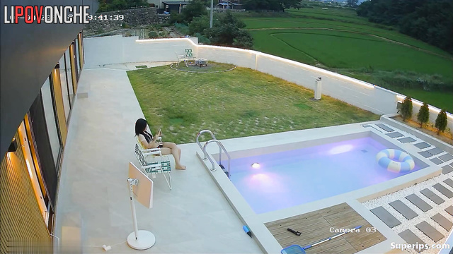 Asian couple having a cute chat in their private pool