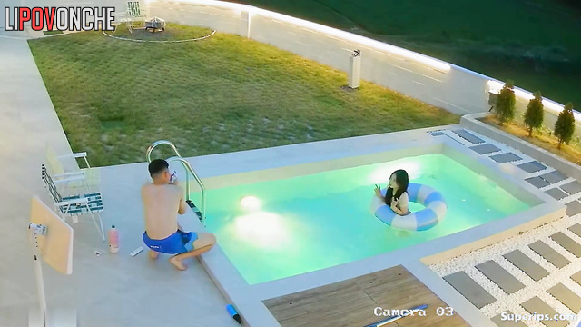 Asian couple having a cute chat in their private pool