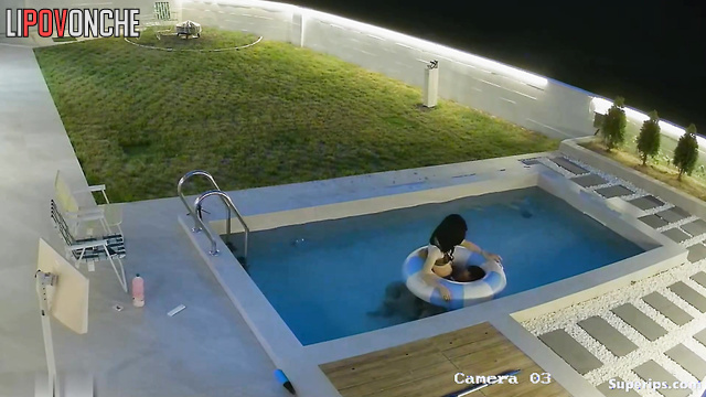 Asian couple having a cute chat in their private pool