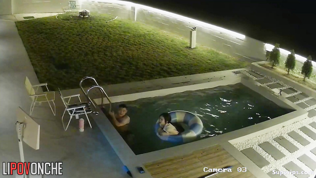 Asian couple having a cute chat in their private pool