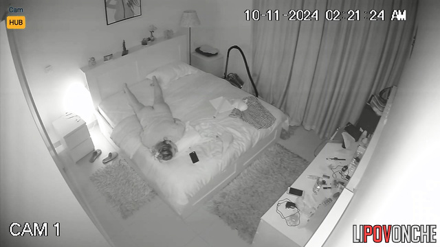 Blonde without panties lying on the bed and masturbating