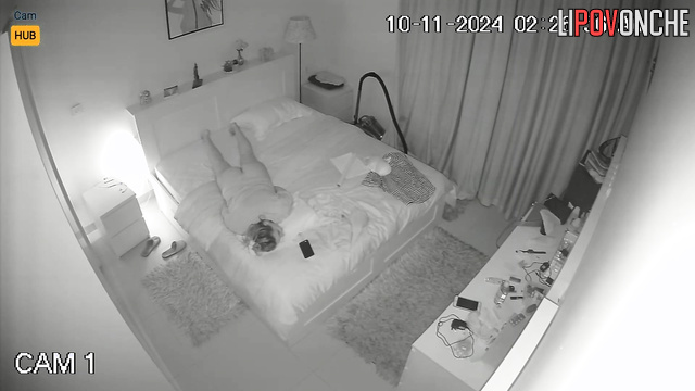 Blonde without panties lying on the bed and masturbating