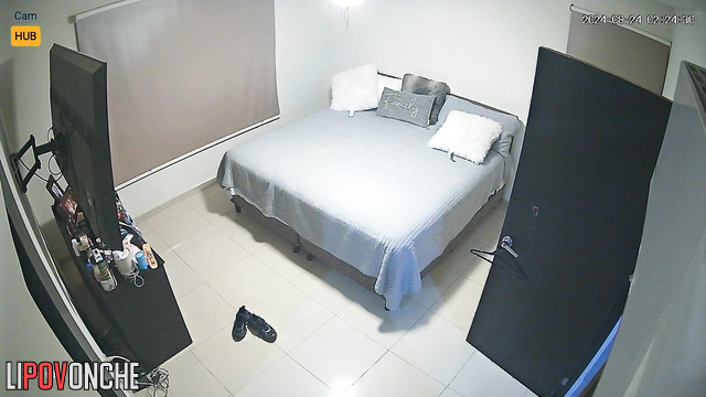 Topless lady chilling on the bed with face mask, hidden video