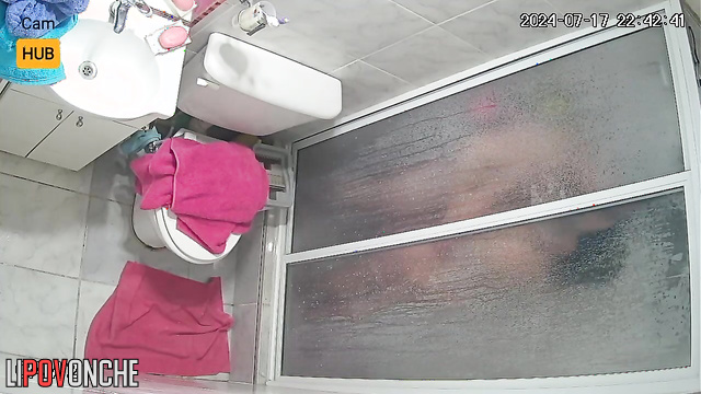 Naked people playing with each other in the bath