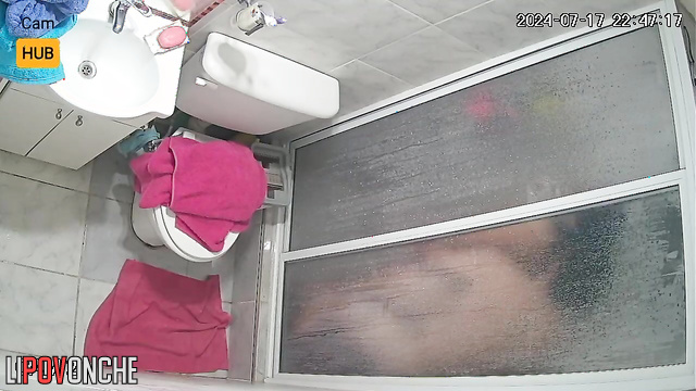 Naked people playing with each other in the bath