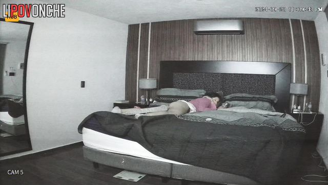 She masturbating on the bed, her partner watching it
