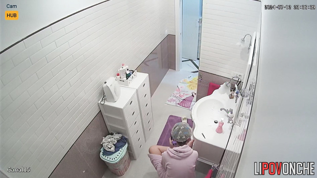 Brunette without bra preparing for a date in her bath