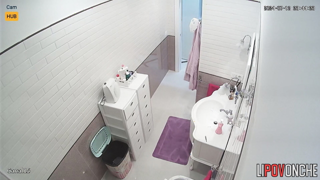 Brunette without bra preparing for a date in her bath