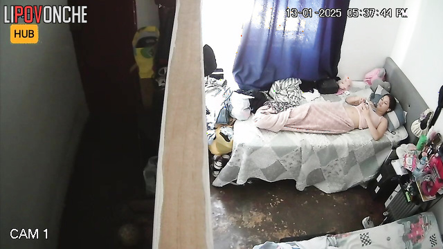Sexy brunette taking photo of her wet pussy on the bed