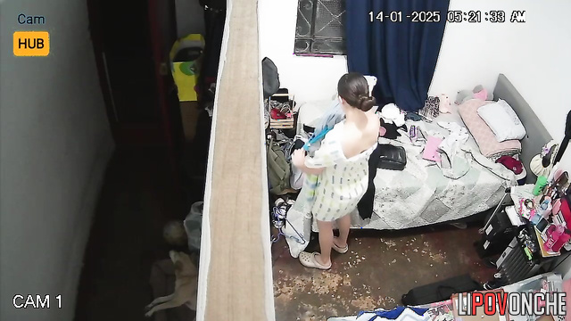 Topless girl dressing and chatting with her boyfriend