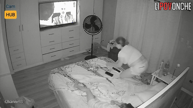 Chubby blonde smoking during tv watching (beside her relative)
