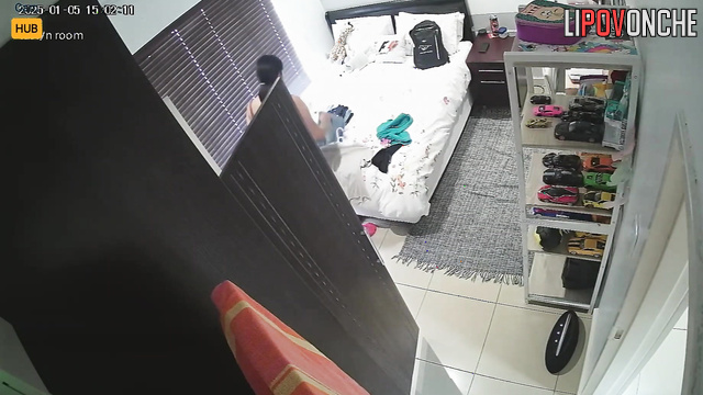Topless brunette does not suspect that she is being watched