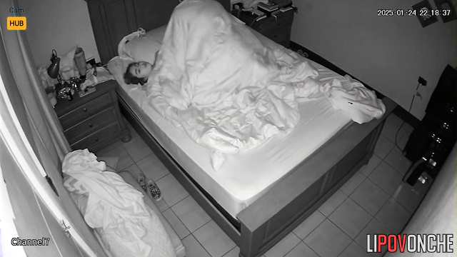 Boyfriend giving her pleasure under the blanket