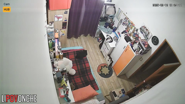Pretty and lonely brunette dressing in their cozy bedroom