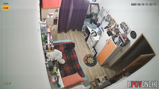 Pretty and lonely brunette dressing in their cozy bedroom