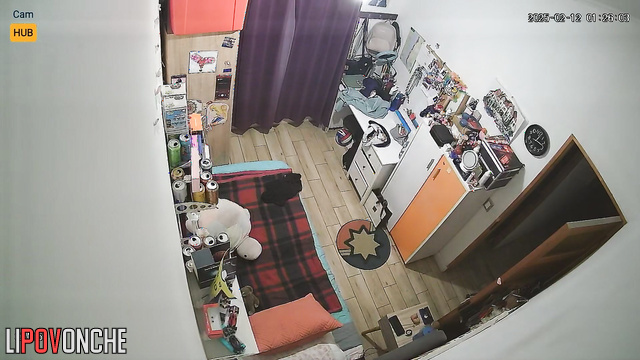 Pretty and lonely brunette dressing in their cozy bedroom
