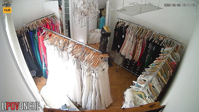 A big-breasted Serbian bride tries on her wedding gown