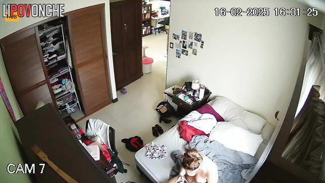 Tattooed naked Costa Rican woman hangs out on her phone after a shower
