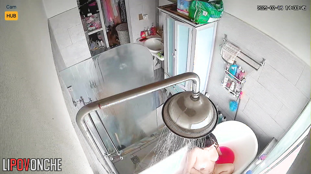 Chubby brunette still didn't realize she was being filmed in the bathroom