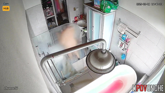 Chubby brunette still didn't realize she was being filmed in the bathroom