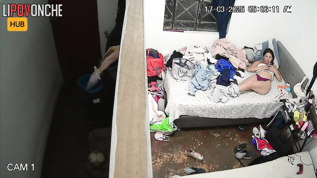 A bored teenage girl plays with her anus with her finger, filming it on her phone