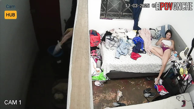 A bored teenage girl plays with her anus with her finger, filming it on her phone