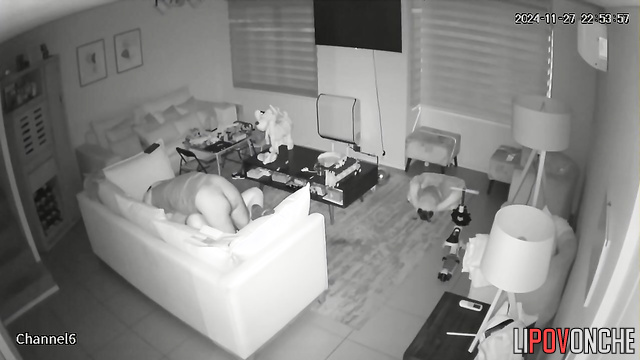 Active sex in the missionary position on a soft sofa