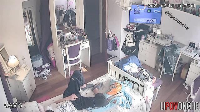 Teens enjoying something interesting under the blanket