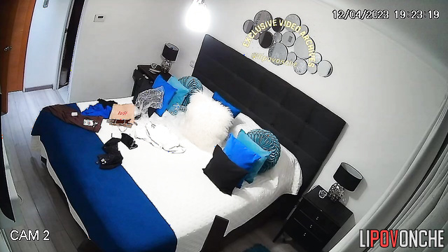 Busty babe dressing and is unaware of the hidden device