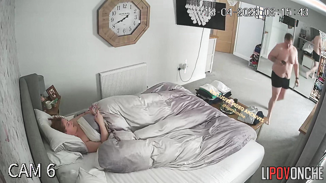Bored tattooed wife takes her husband's cock out of his pants and strokes it