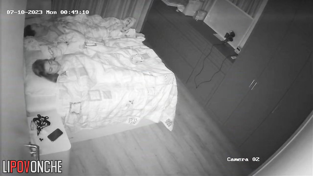 Husband is sleeping and doesn't know what she's doing under the blanket