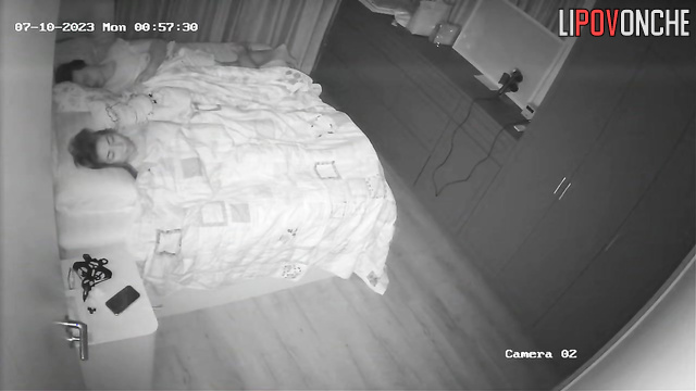 Husband is sleeping and doesn't know what she's doing under the blanket