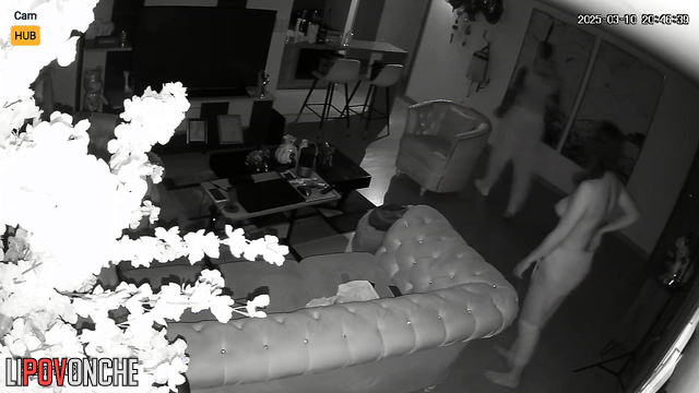 Couple enjoying each other before parents arrive, living room tape