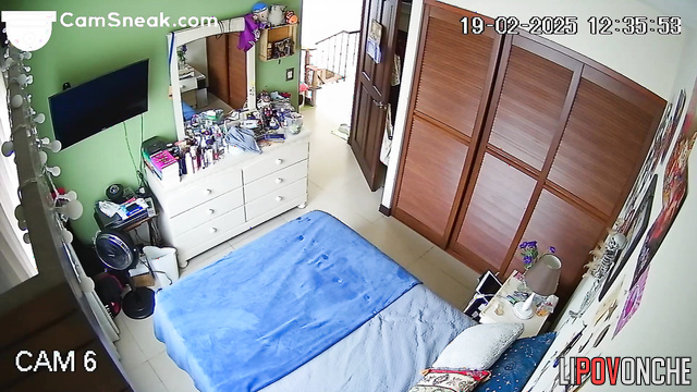 Young tattooed student loves playing on her tablet while naked