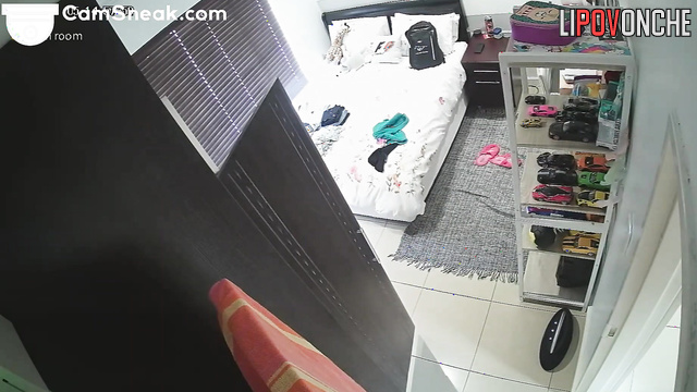 A young girl with a seductive body tries on clothes to meet her lover