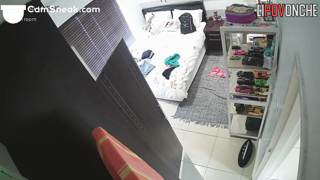 A young girl with a seductive body tries on clothes to meet her lover