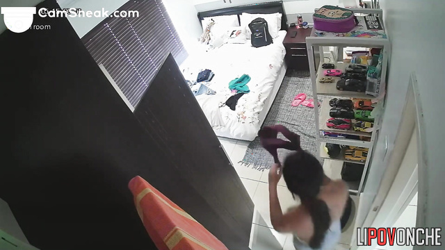 A young girl with a seductive body tries on clothes to meet her lover