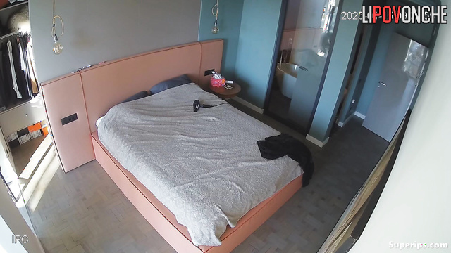 Skinny woman pleasing herself lying on bed, watch