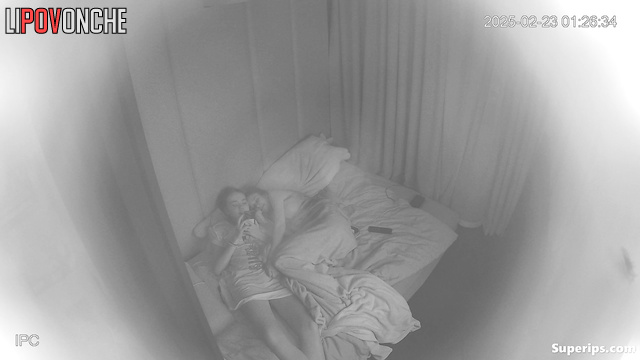 Two lesbian Ukrainians spend a free evening in bed in each other's arms