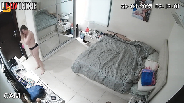 Private video of a big-breasted blonde getting dressed after a shower