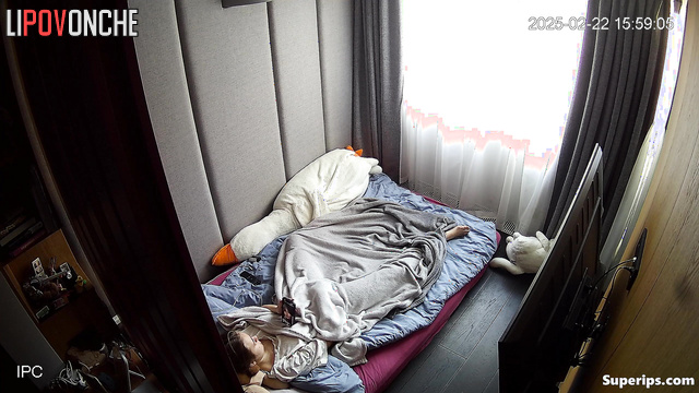 She works her fingers very quickly under the blanket