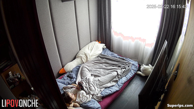 She works her fingers very quickly under the blanket