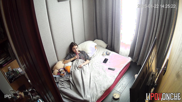 Teen with beauty face eating right in her warm bed