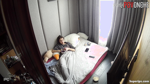 Teen with beauty face eating right in her warm bed