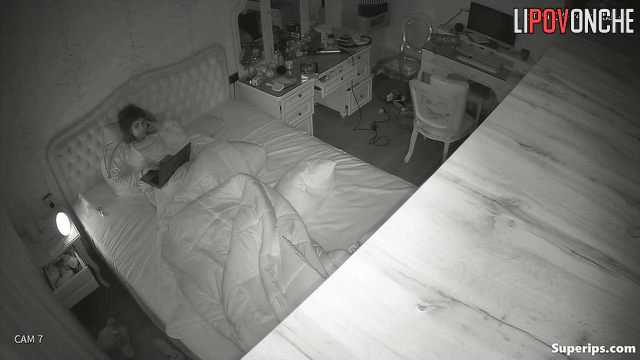 Young naked student giving pleasure to herself in bed