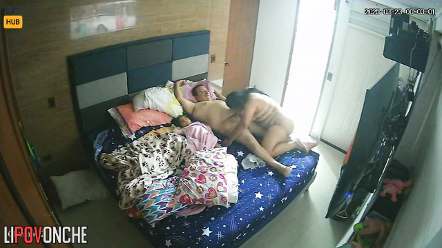 Chubby married couple actively fucks while an uninteresting movie is on TV